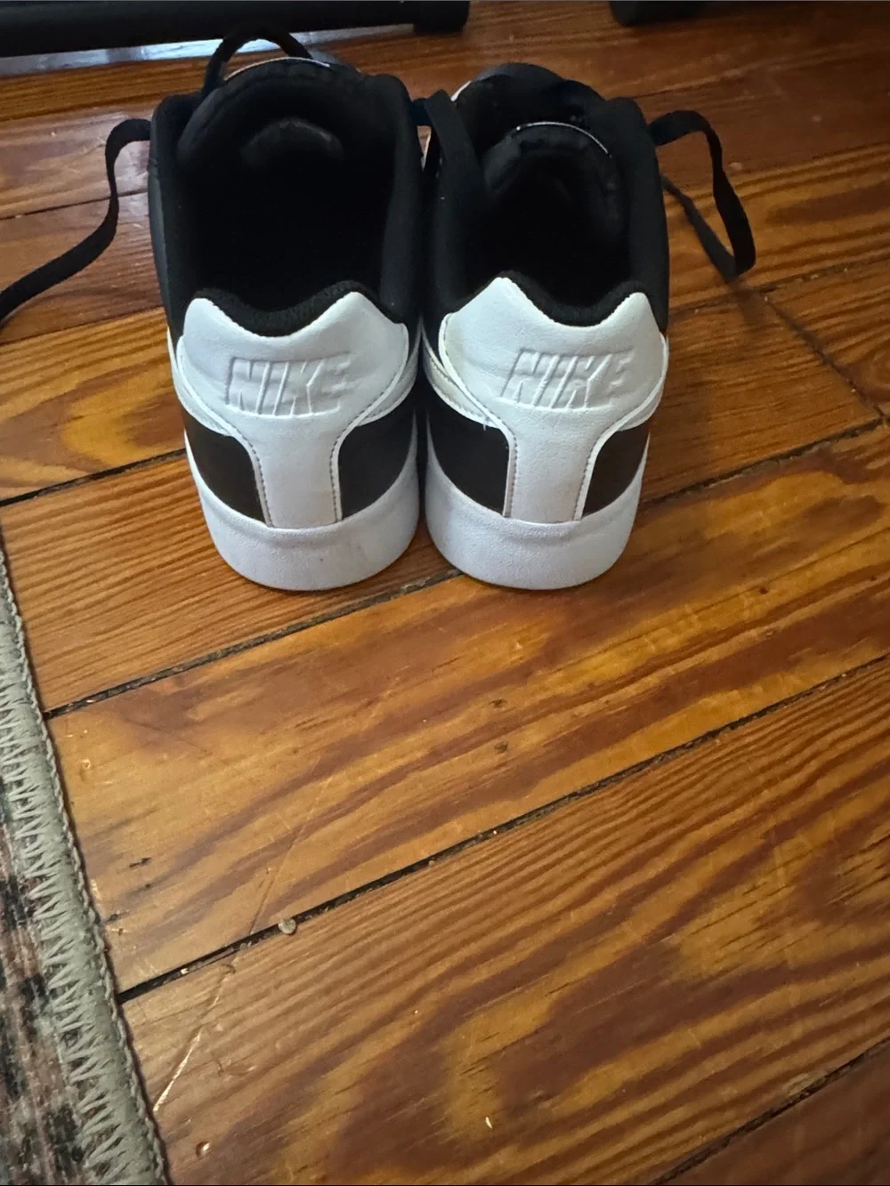 Nike Black Low-Top Sneakers with White Swoosh